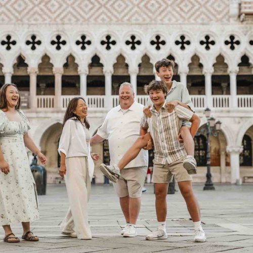 Emotional family portrait in Venice A family sharing a beautiful moment under the porticoes of St. Mark’s Square.