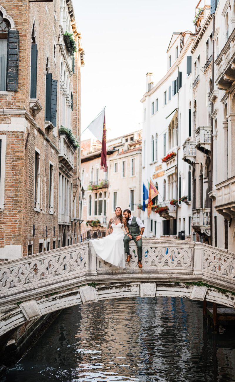 honeymoon couple portrait near small Venetian bridge