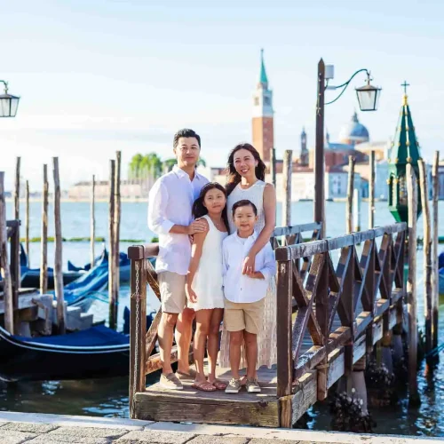 Evening walk in Venice Parents and children walking side by side in Venice at sunset