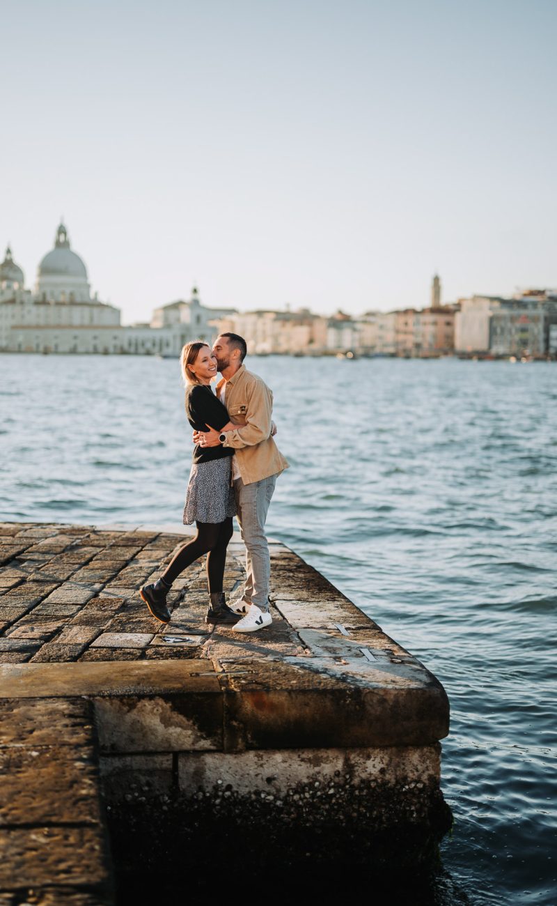 romantic honeymoon couple portrait near Venetian lagoon